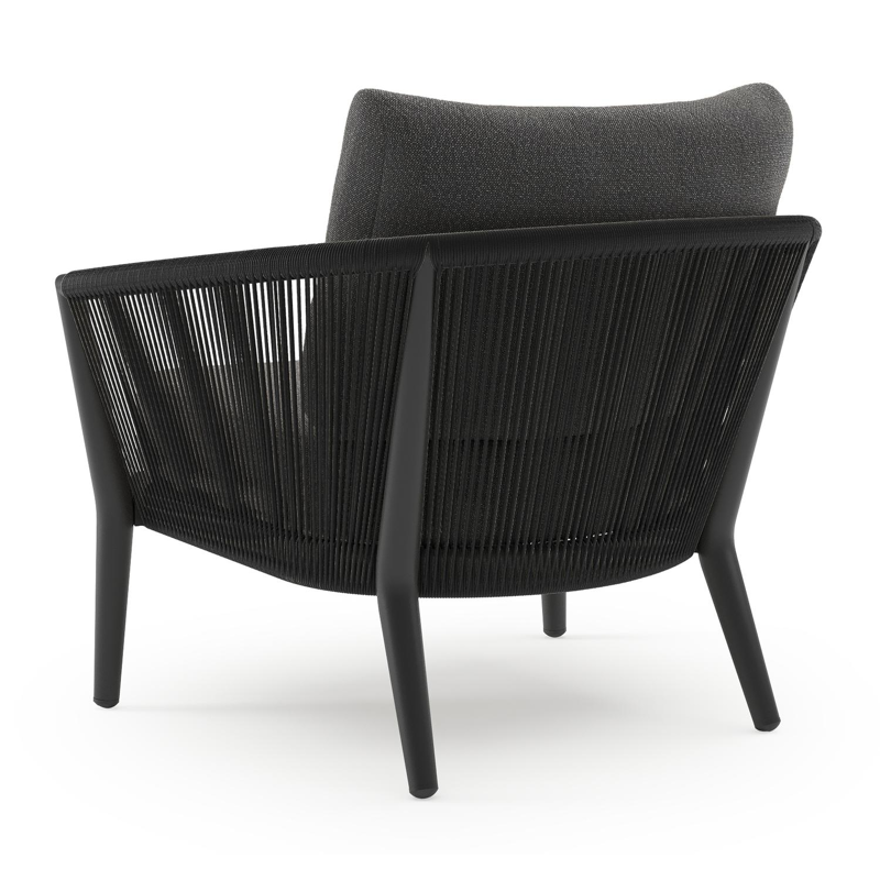 Fauteuil de jardin Orso en aluminium noir en corde ronde tissée verticalement noir et coussins en all weather sunbrella® luxe Savane Tornado