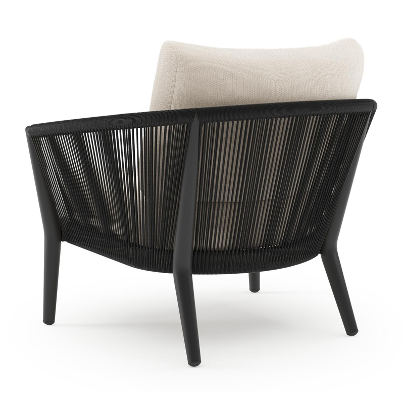 Orso loungestoel in zwart aluminium en zwart verticaal geweven ronde rope met Lopi Snow all weather sunbrella® luxe kussen
