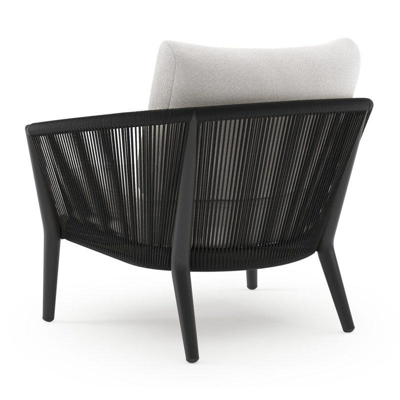 Orso loungestoel in zwart aluminium en zwart verticaal geweven ronde rope met Soul Optik all weather solica kussen
