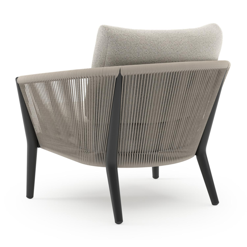 Orso loungestoel in zwart aluminium en beige verticaal geweven ronde rope met Firenze Natural all weather solica kussen