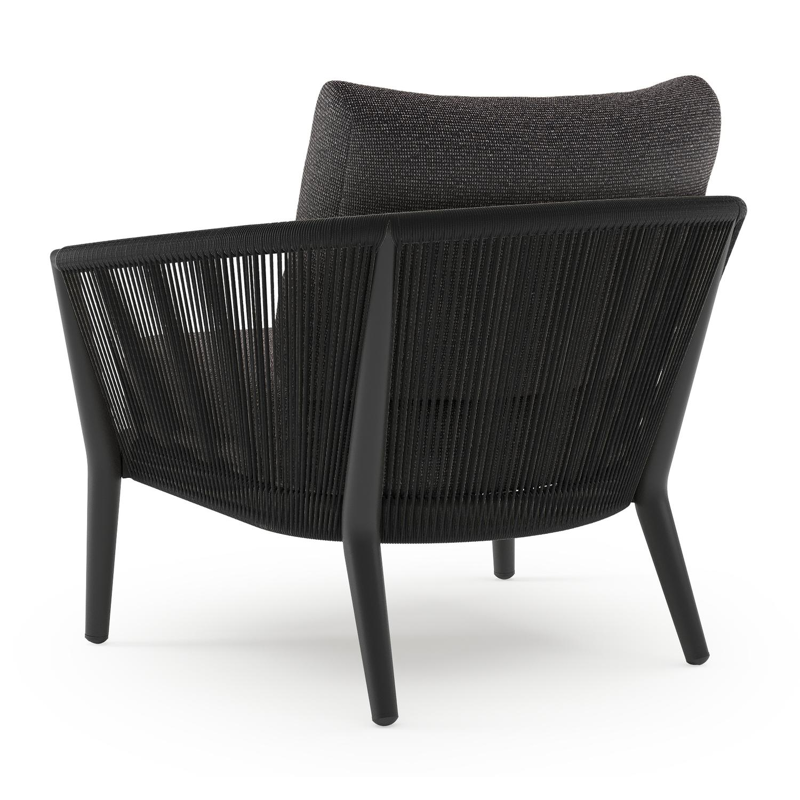 Orso loungestoel in zwart aluminium en zwart verticaal geweven ronde rope met Firenze Tunder all weather solica kussen