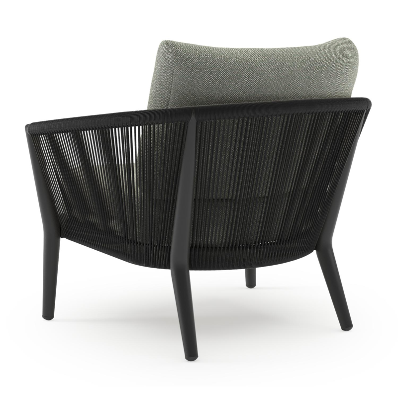 Orso loungestoel in zwart aluminium en zwart verticaal geweven ronde rope met Savane Leaf all weather sunbrella® luxe kussen