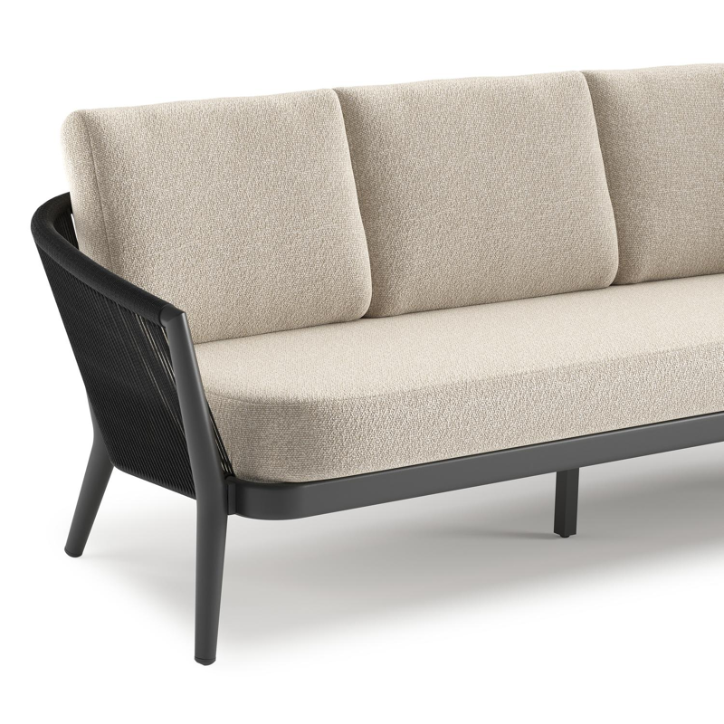 Orso loungeset in zwart aluminium en zwart verticaal geweven ronde rope met Marbella Ecru all weather cosytica kussen