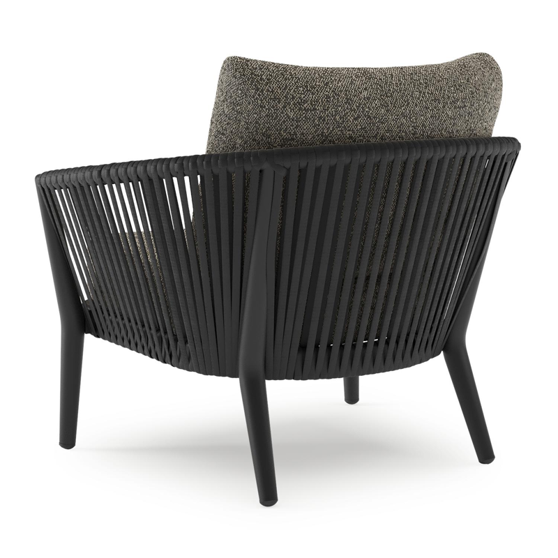 Orso loungestoel in zwart aluminium en zwart verticaal geweven ronde rope met Marbella Tunder all weather cosytica kussen