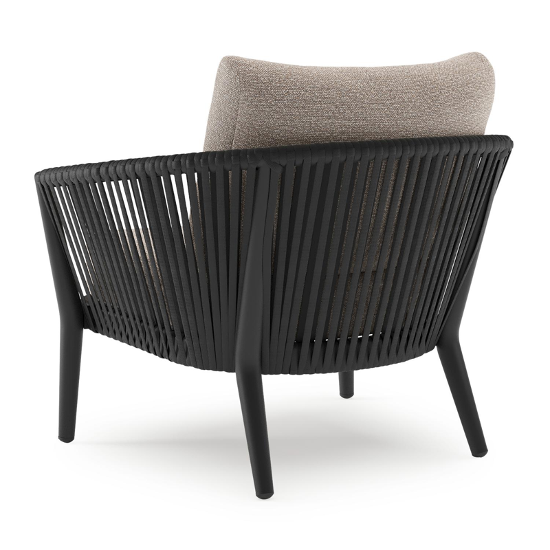 Orso loungestoel in zwart aluminium en zwart verticaal geweven luxe vlakke rope met Wander Manioc all weather sunbrella® luxe kussen