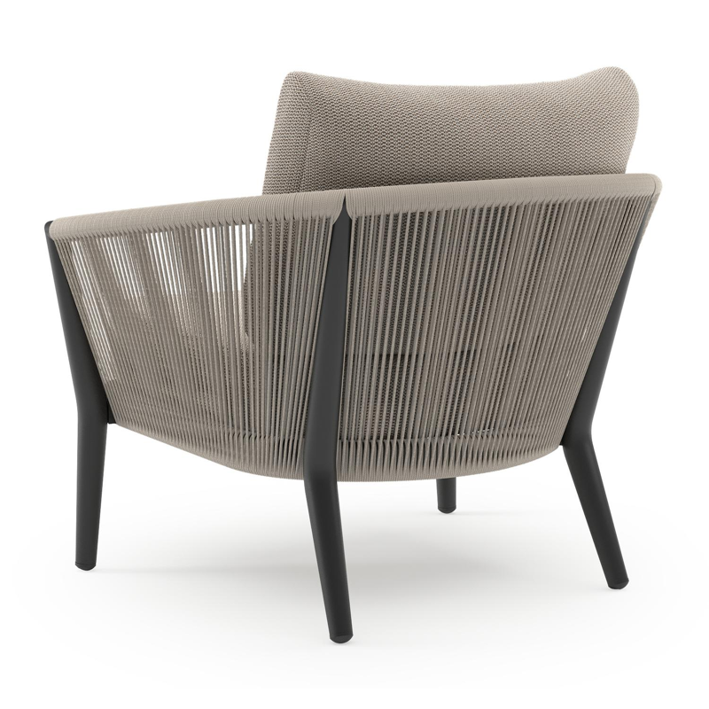 Fauteuil de jardin Orso en aluminium noir en corde ronde tissée verticalement beige et coussins en all weather sunbrella® luxe Lopi Fossil