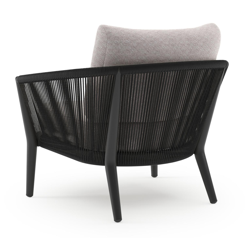 Fauteuil de jardin Orso en aluminium noir en corde ronde tissée verticalement noir et coussins en all weather sunbrella® luxe Wander Gobi