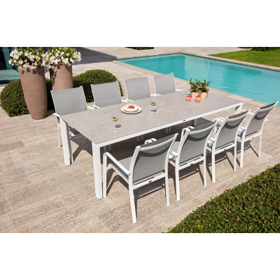 Trente tuinset in wit aluminium en volkeramiek grijs tafelblad met 8 stapelbare Calobra tuinstoelen