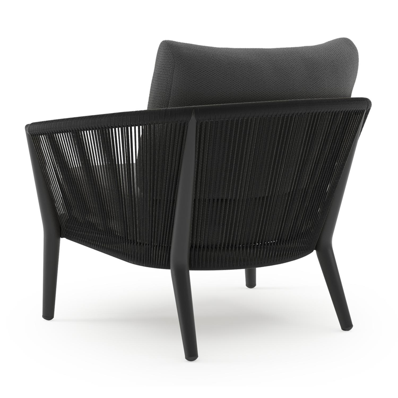 Orso loungestoel in zwart aluminium en zwart verticaal geweven ronde rope met Lopi Shadow all weather sunbrella® luxe kussen